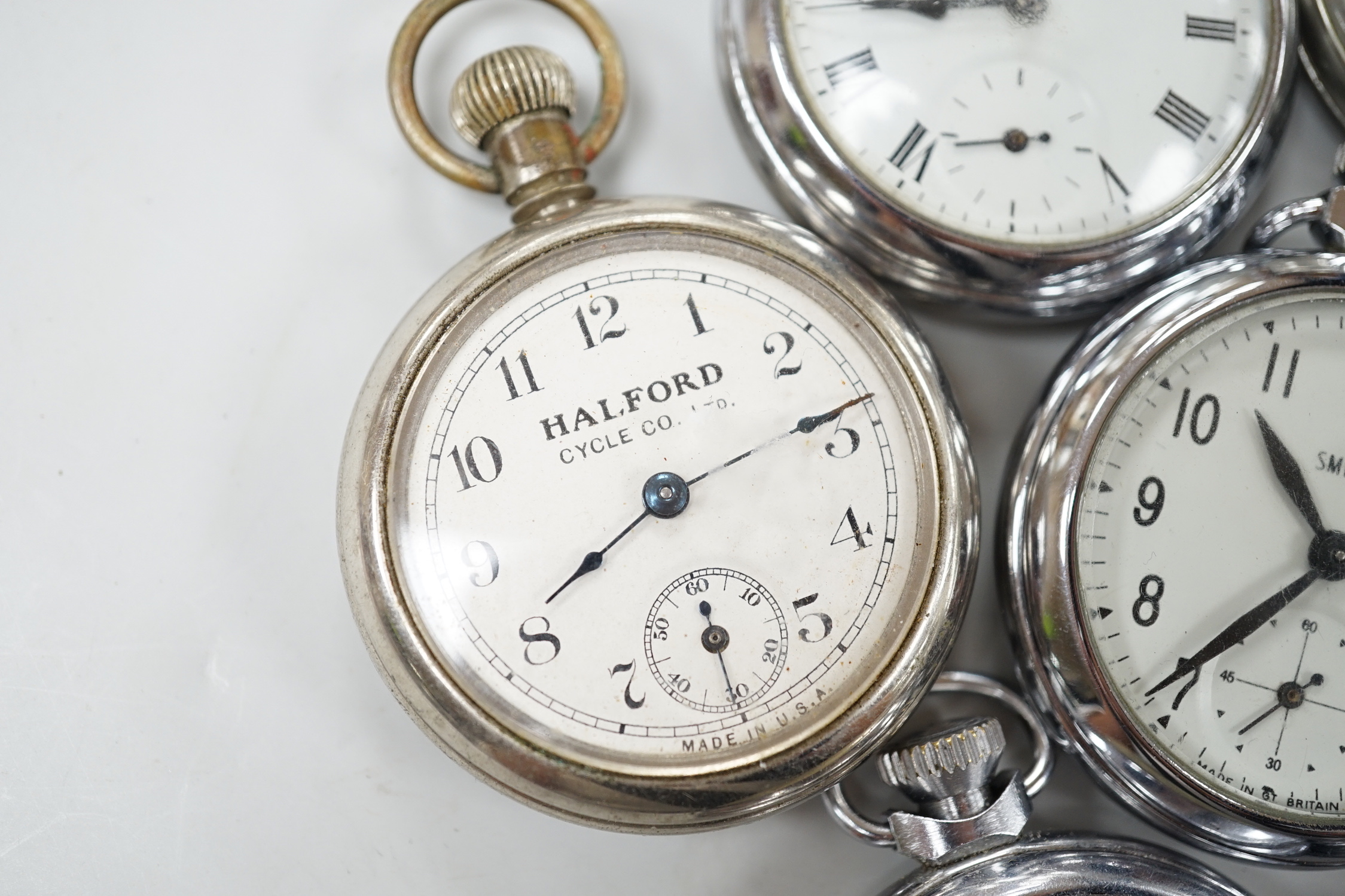 Ten assorted base metal pocket watches including Ingersoll and Smiths.